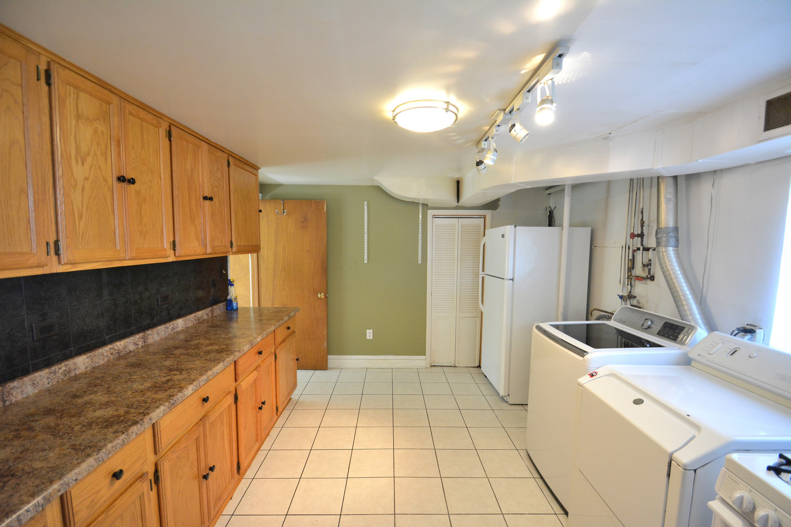 358 Walnut Avenue, Unit A Wheeling, IL 60090 - Photo 2 of 3 a kitchen with stainless steel appliances granite countertop a refrigerator and a sink