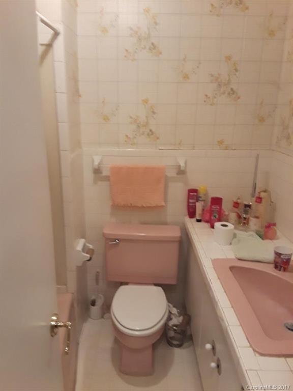 323 North Burris Road Sharon, SC 29742 - Photo 8 of 8 a bathroom with a sink toilet vanity and tub