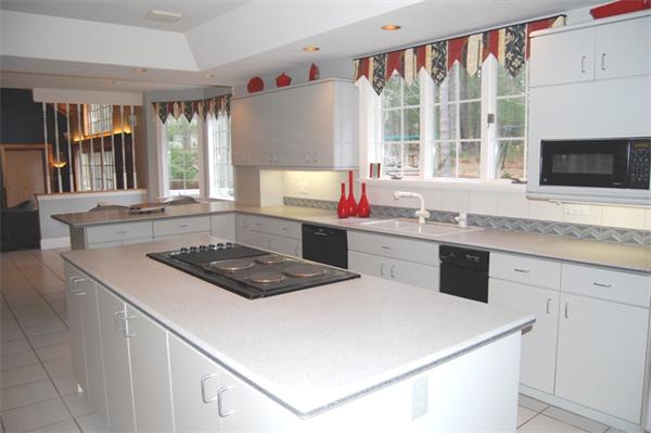 24 Carriage Drive Lexington, MA 02420 - Photo 14 of 30 a kitchen with a stove a sink and a microwave