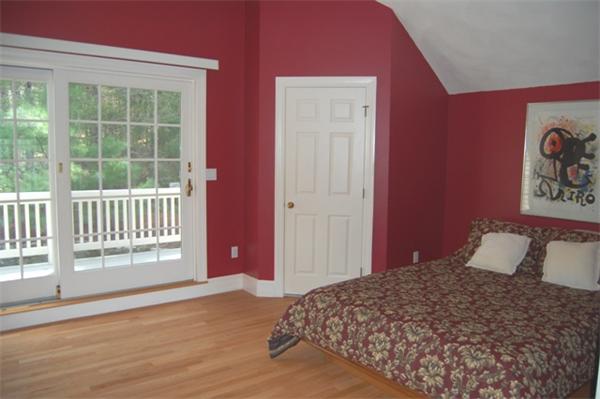 24 Carriage Drive Lexington, MA 02420 - Photo 19 of 30 a bedroom with a bed and a window
