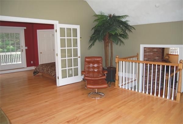 24 Carriage Drive Lexington, MA 02420 - Photo 20 of 30 a balcony with table and chairs