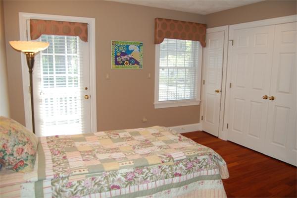 24 Carriage Drive Lexington, MA 02420 - Photo 25 of 30 a bedroom with a bed and a window
