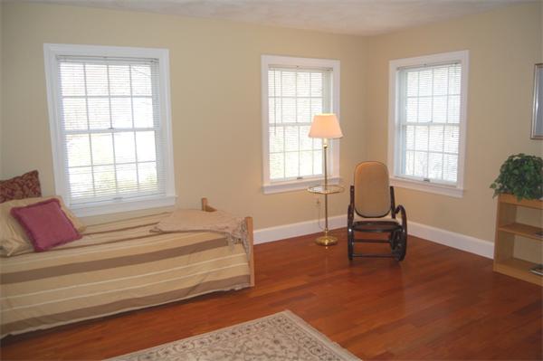 24 Carriage Drive Lexington, MA 02420 - Photo 26 of 30 a spacious bedroom with a bed and a window
