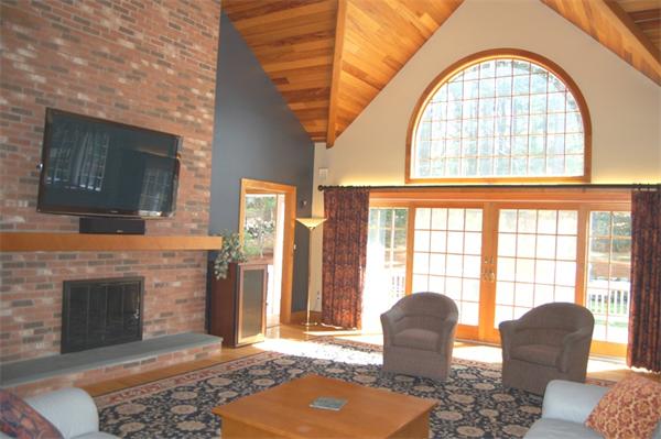 24 Carriage Drive Lexington, MA 02420 - Photo 9 of 30 a living room with furniture fireplace and flat screen tv