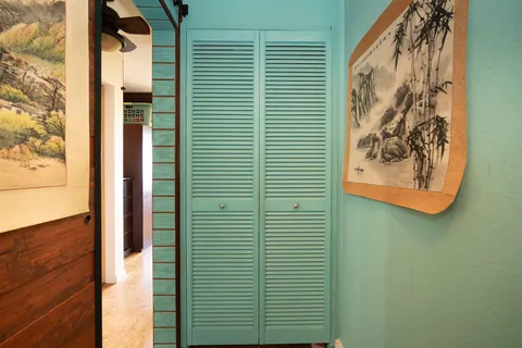 a view of a door and a window