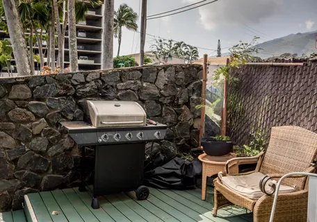 a front view of a house with outdoor seating