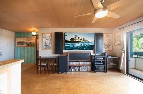a view of a livingroom with furniture and a flat screen tv