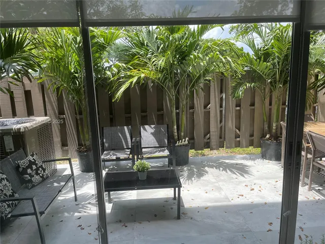 a swimming pool with outdoor seating