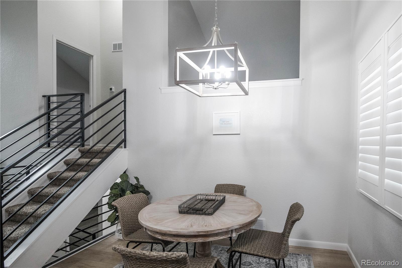 2920 South Racine Street Aurora, CO 80014 - Photo 11 of 36 a table and chairs in a room