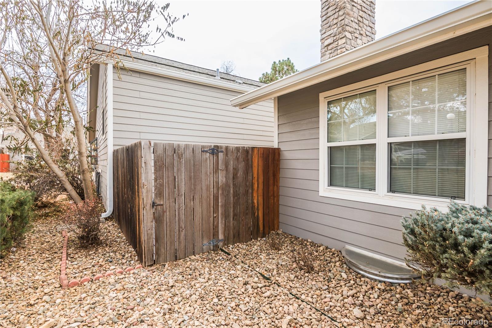 2920 South Racine Street Aurora, CO 80014 - Photo 33 of 36 a view of a house with a backyard