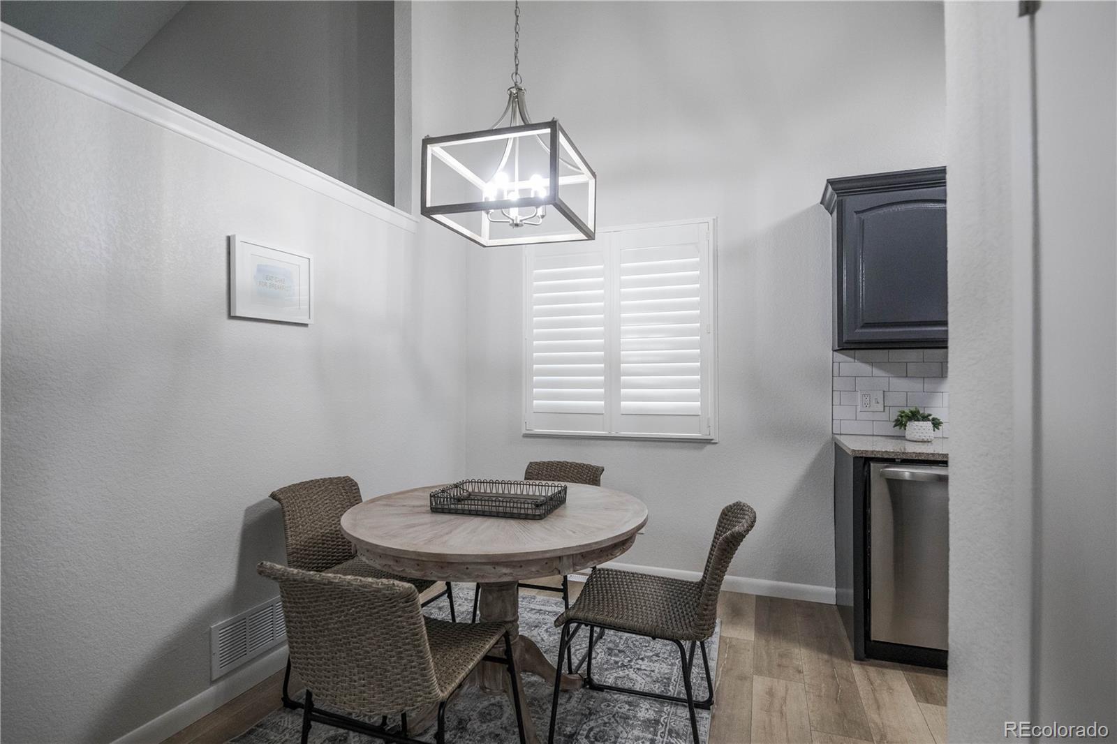 2920 South Racine Street Aurora, CO 80014 - Photo 7 of 36 a dining room with furniture and window