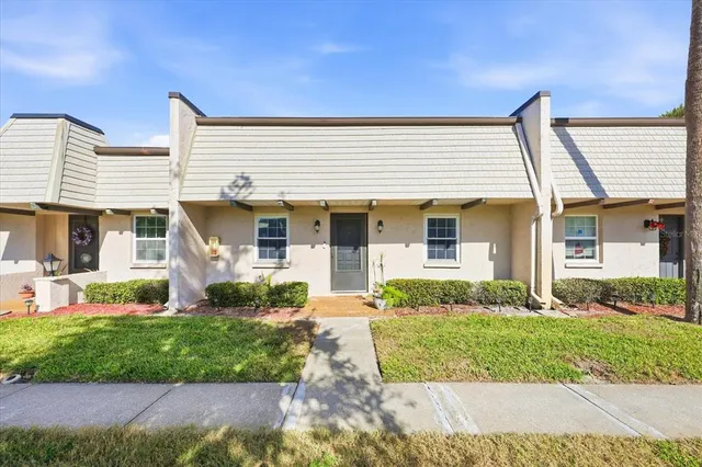 front view of a house with a yard
