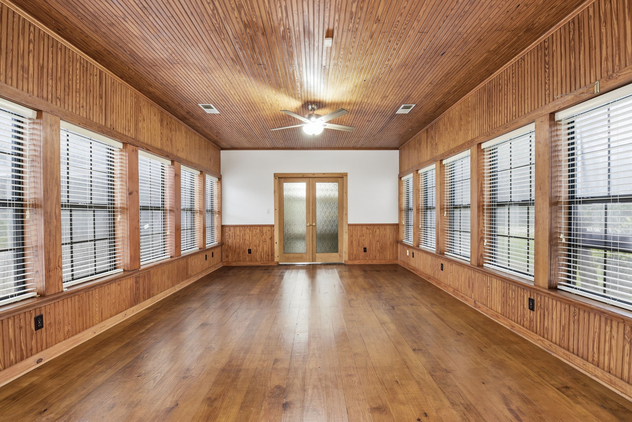 21531 Tophill Drive Spring, TX 77388 - Photo 18 of 49 a view of an empty room with a window and wooden floor