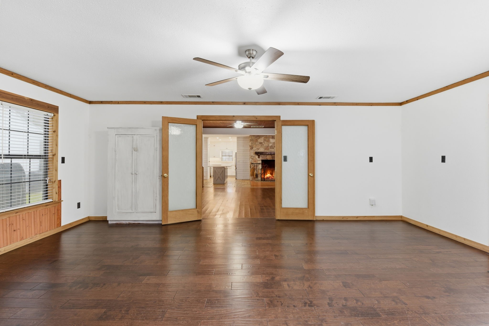 21531 Tophill Drive Spring, TX 77388 - Photo 20 of 49 a view of an empty room with wooden floor and a window
