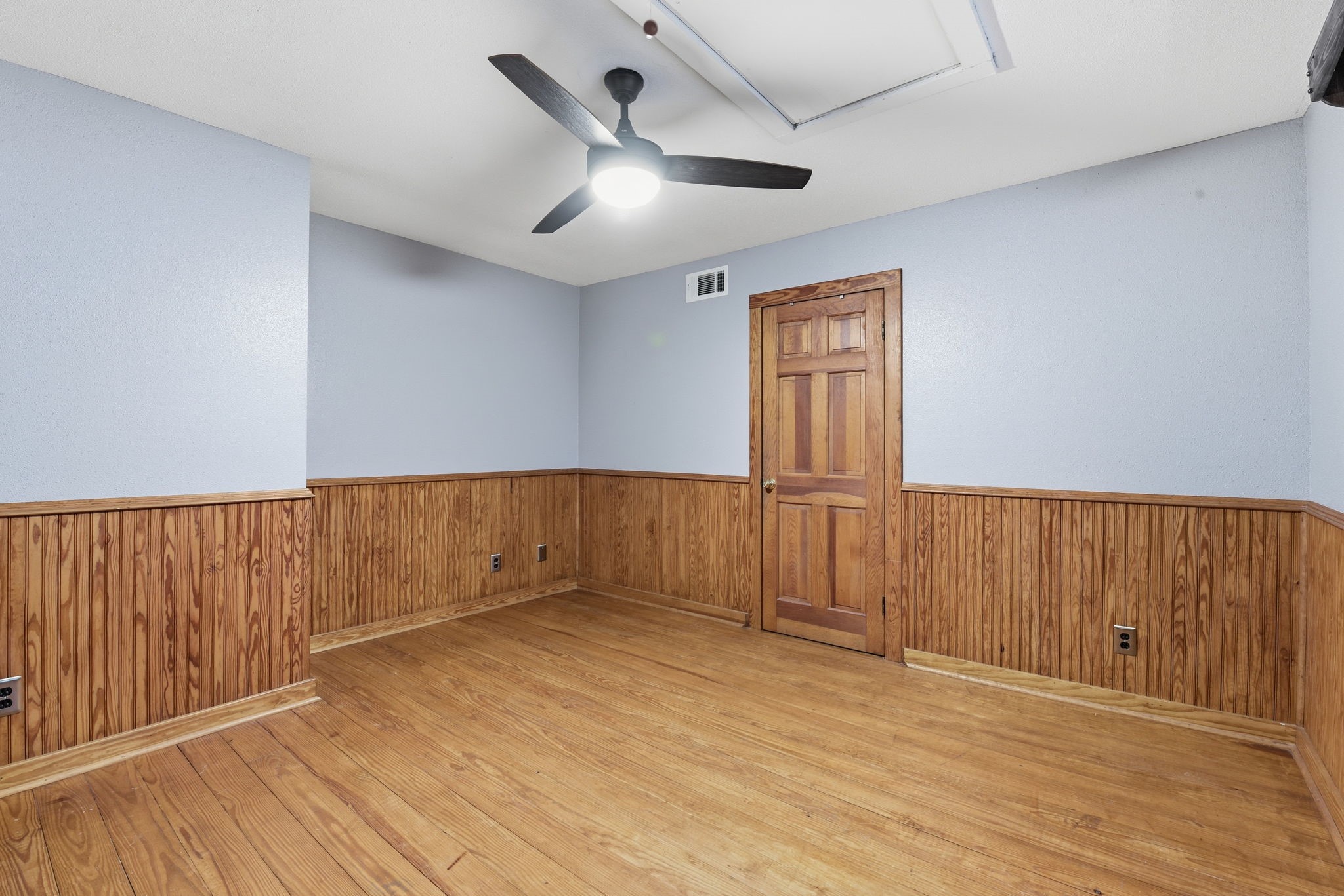 21531 Tophill Drive Spring, TX 77388 - Photo 28 of 49 an empty room with wooden floor and windows