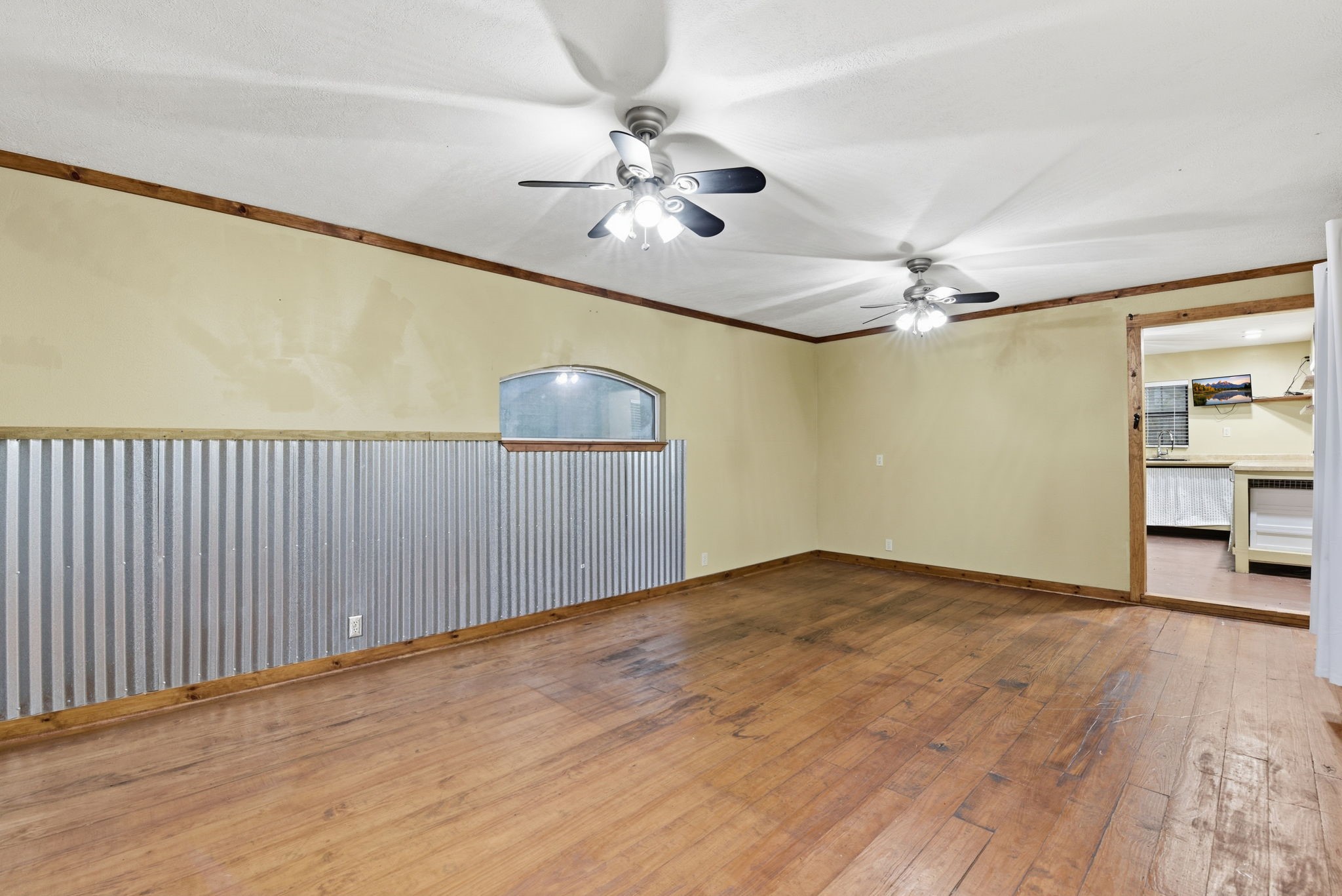 21531 Tophill Drive Spring, TX 77388 - Photo 34 of 49 wooden floor in an empty room with a chandelier fan