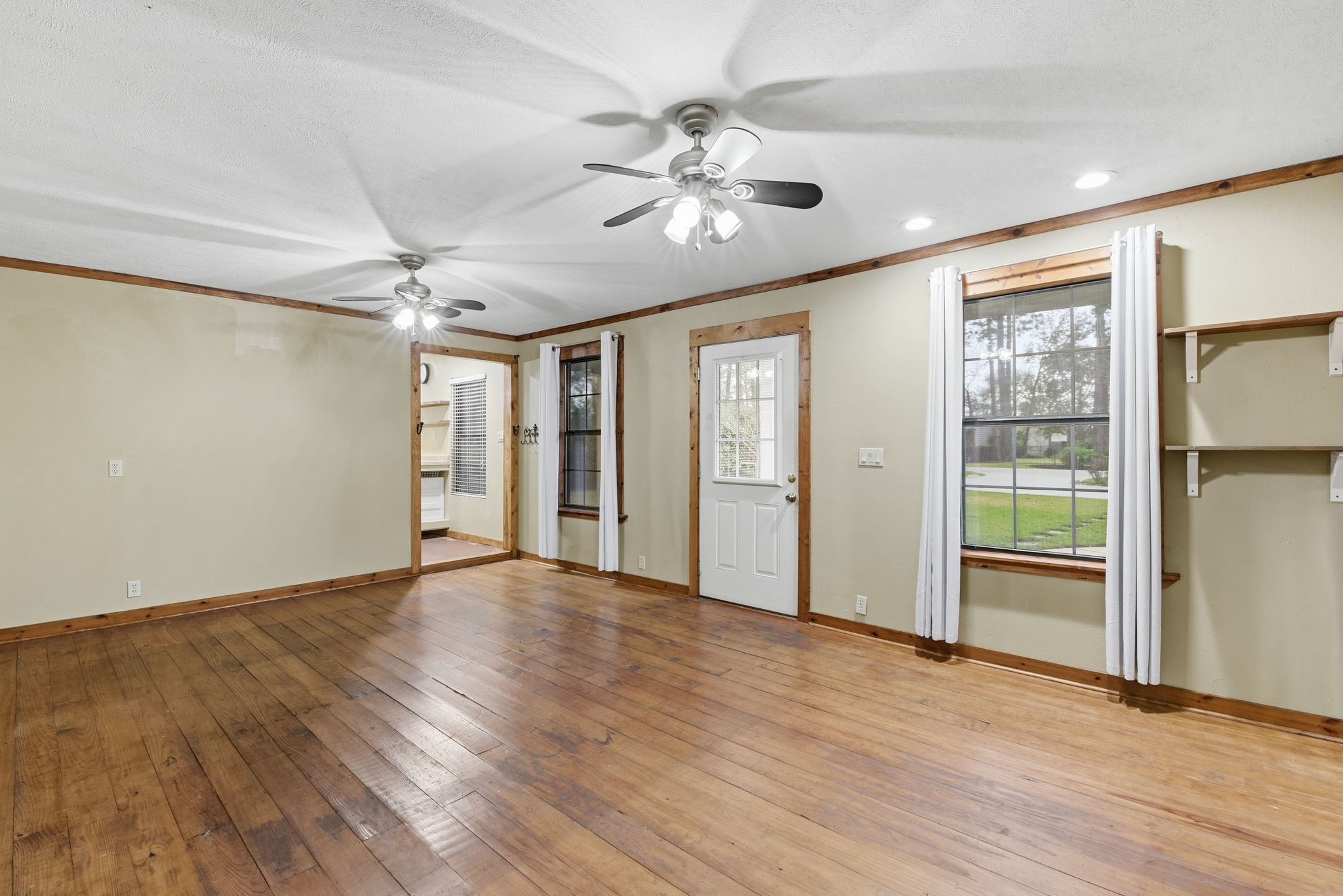 21531 Tophill Drive Spring, TX 77388 - Photo 35 of 49 a view of an empty room with a window and wooden floor