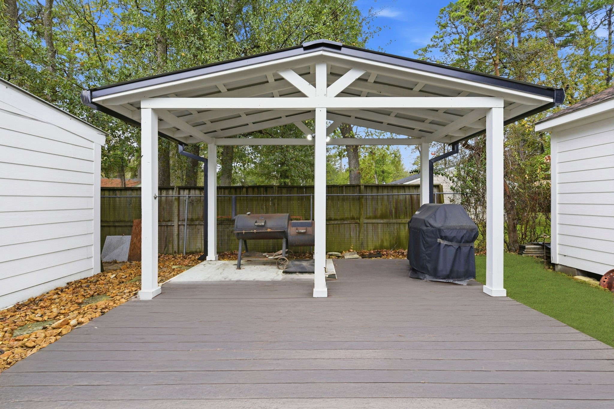 21531 Tophill Drive Spring, TX 77388 - Photo 40 of 49 a patio with table and chairs and potted plants