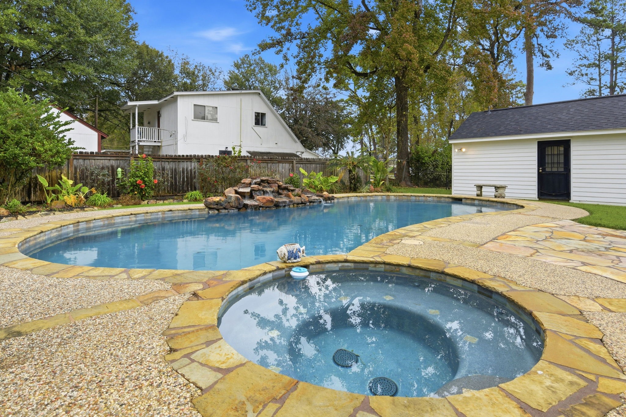 21531 Tophill Drive Spring, TX 77388 - Photo 44 of 49 a view of a swimming pool with an outdoor space and seating area