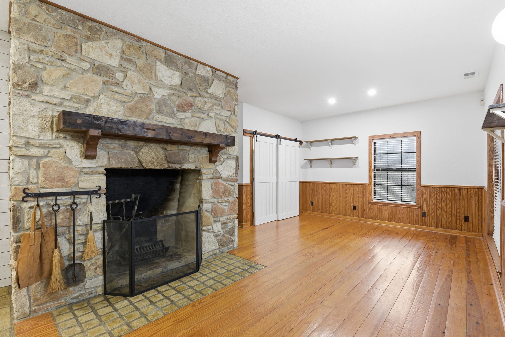21531 Tophill Drive Spring, TX 77388 - Photo 5 of 49 a view of empty room with wooden floor and fireplace