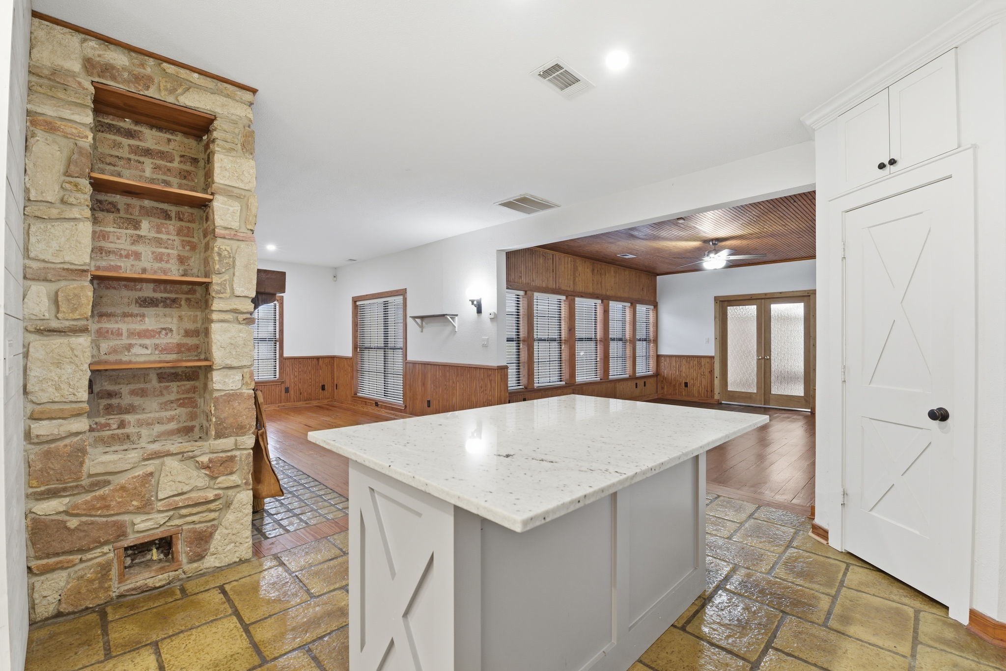 21531 Tophill Drive Spring, TX 77388 - Photo 9 of 49 a large white kitchen with granite countertop a sink and cabinets