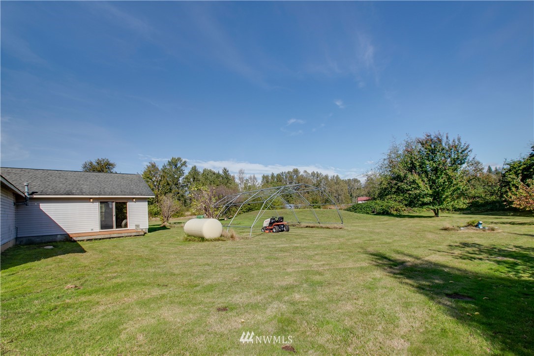 4520 Rural Avenue Bellingham, WA 98226 - Photo 22 of 24 a front view of a house with a yard and trees