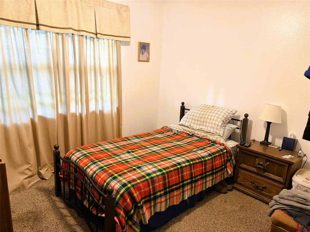 310 Murray Lane Haughton, LA 71037 - Photo 11 of 17 a bedroom with a bed and wooden floor