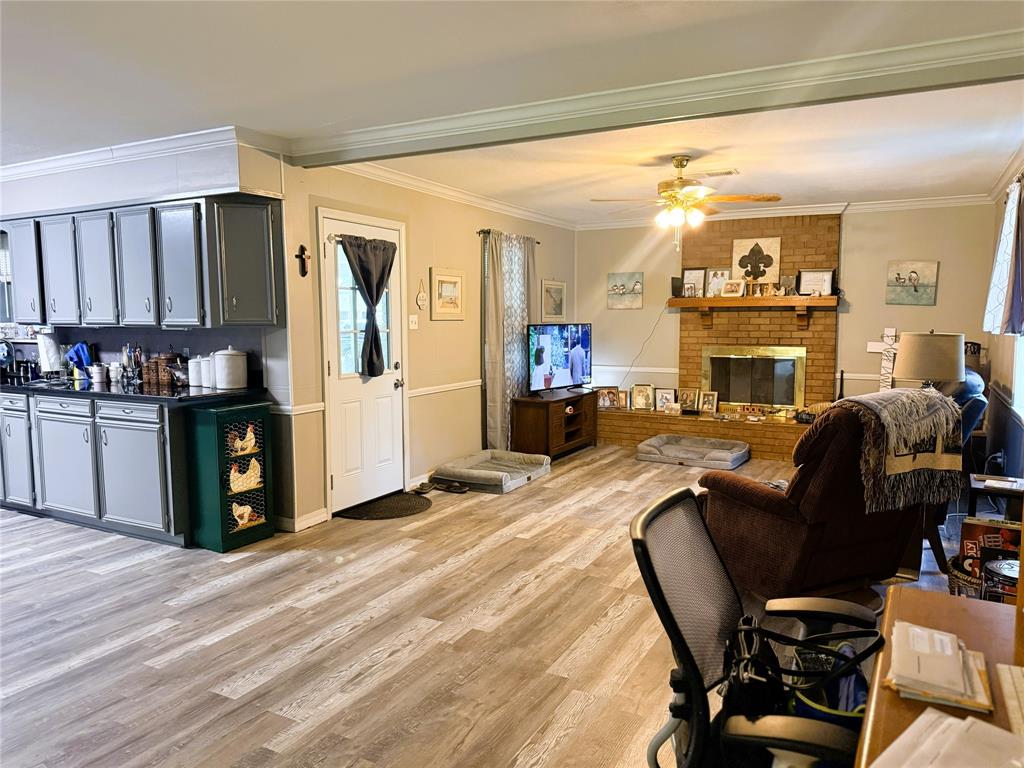 310 Murray Lane Haughton, LA 71037 - Photo 4 of 17 a living room with furniture a fireplace and a kitchen view