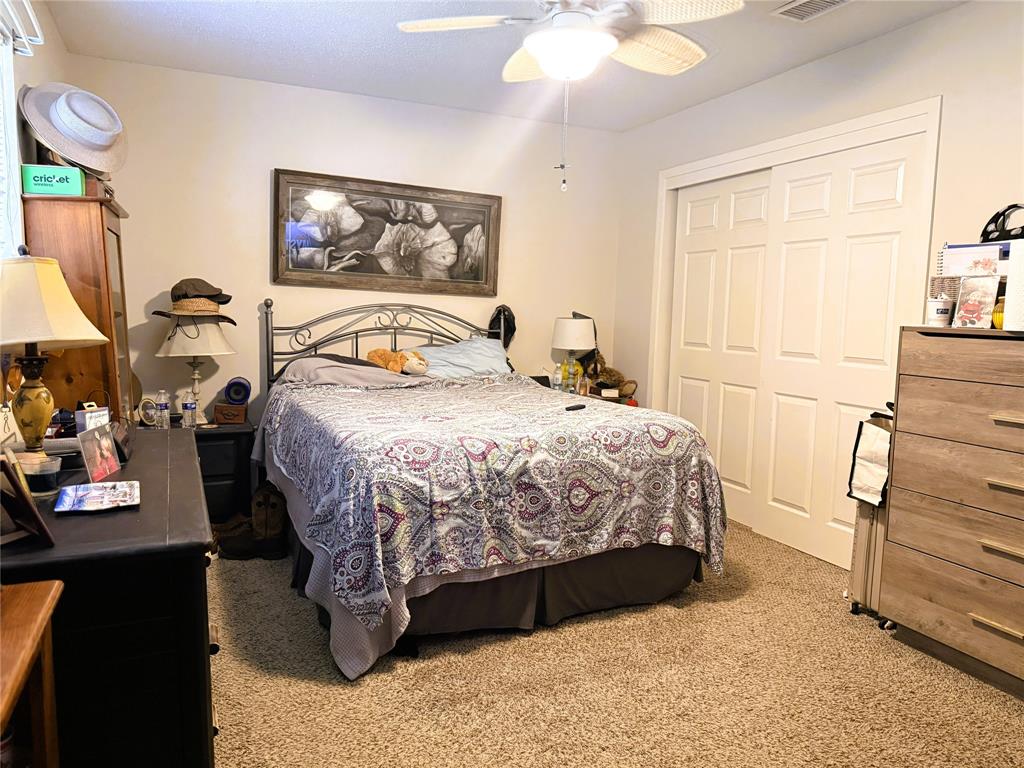 310 Murray Lane Haughton, LA 71037 - Photo 8 of 17 a bedroom with a bed table and window