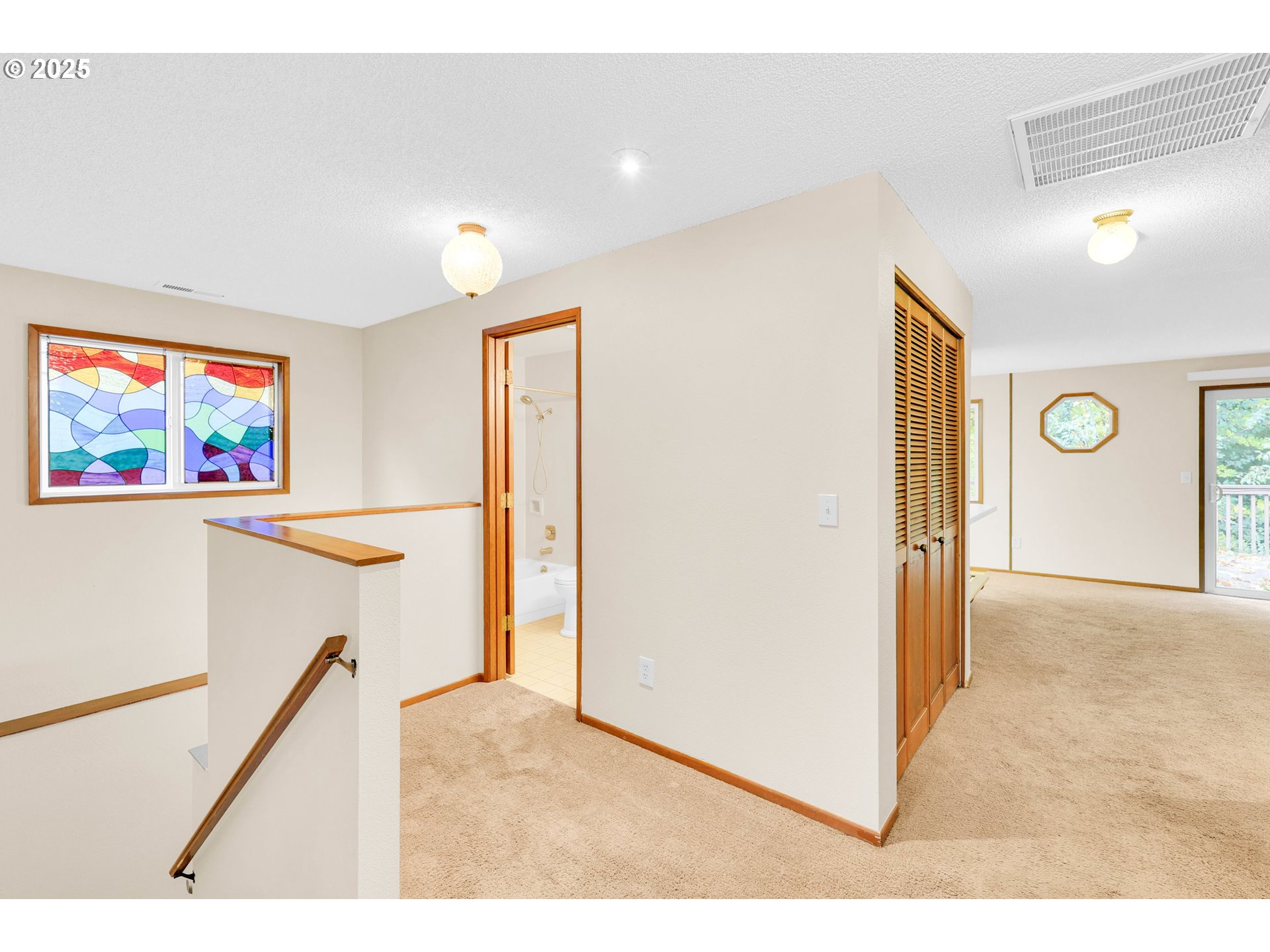 1003 Northwest 132nd Street Vancouver, WA 98685 - Photo 12 of 26 a view of a hallway with paintings on the wall