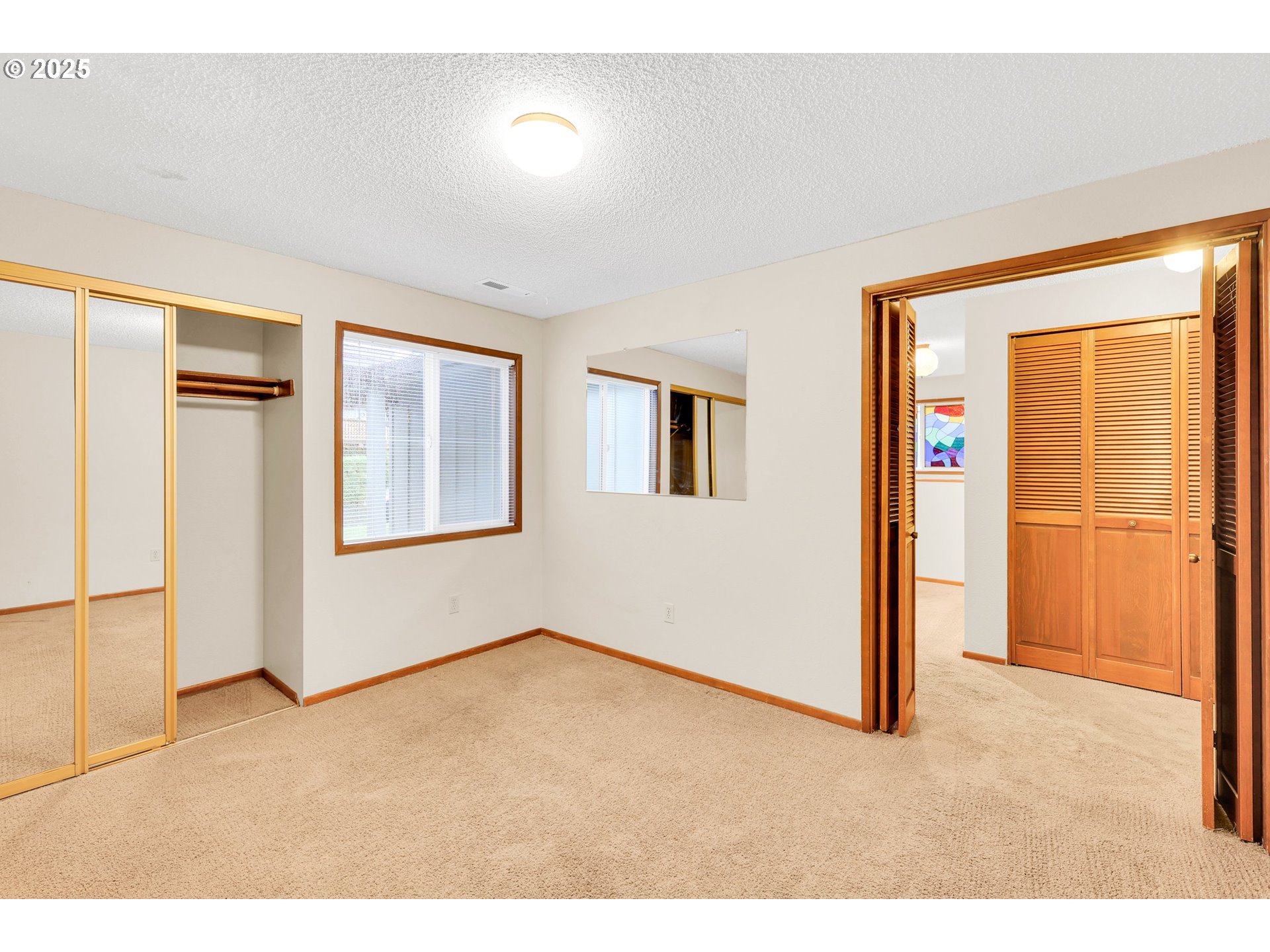 1003 Northwest 132nd Street Vancouver, WA 98685 - Photo 15 of 26 an empty room with windows and closet