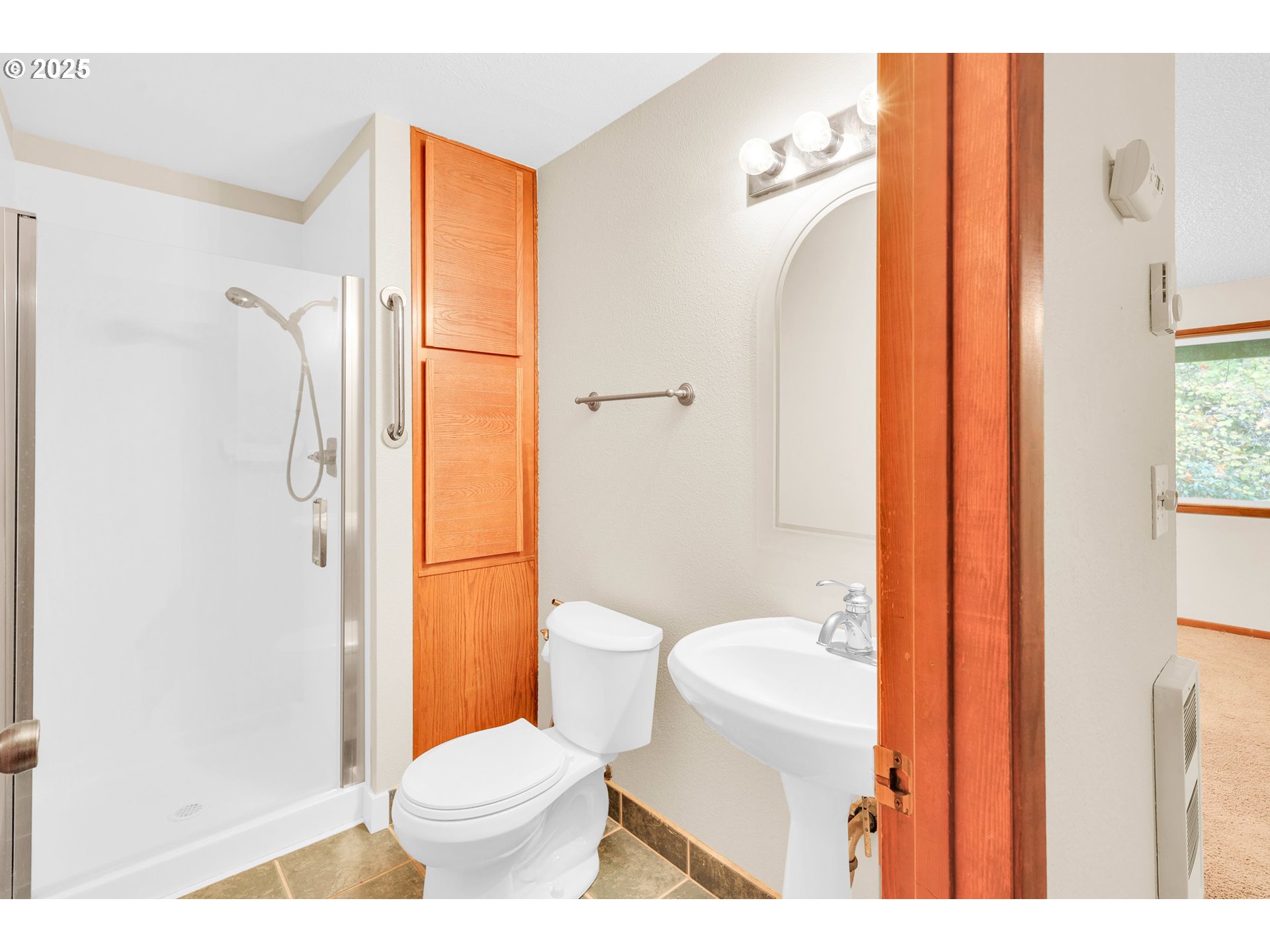 1003 Northwest 132nd Street Vancouver, WA 98685 - Photo 21 of 26 a bathroom with a toilet and a shower