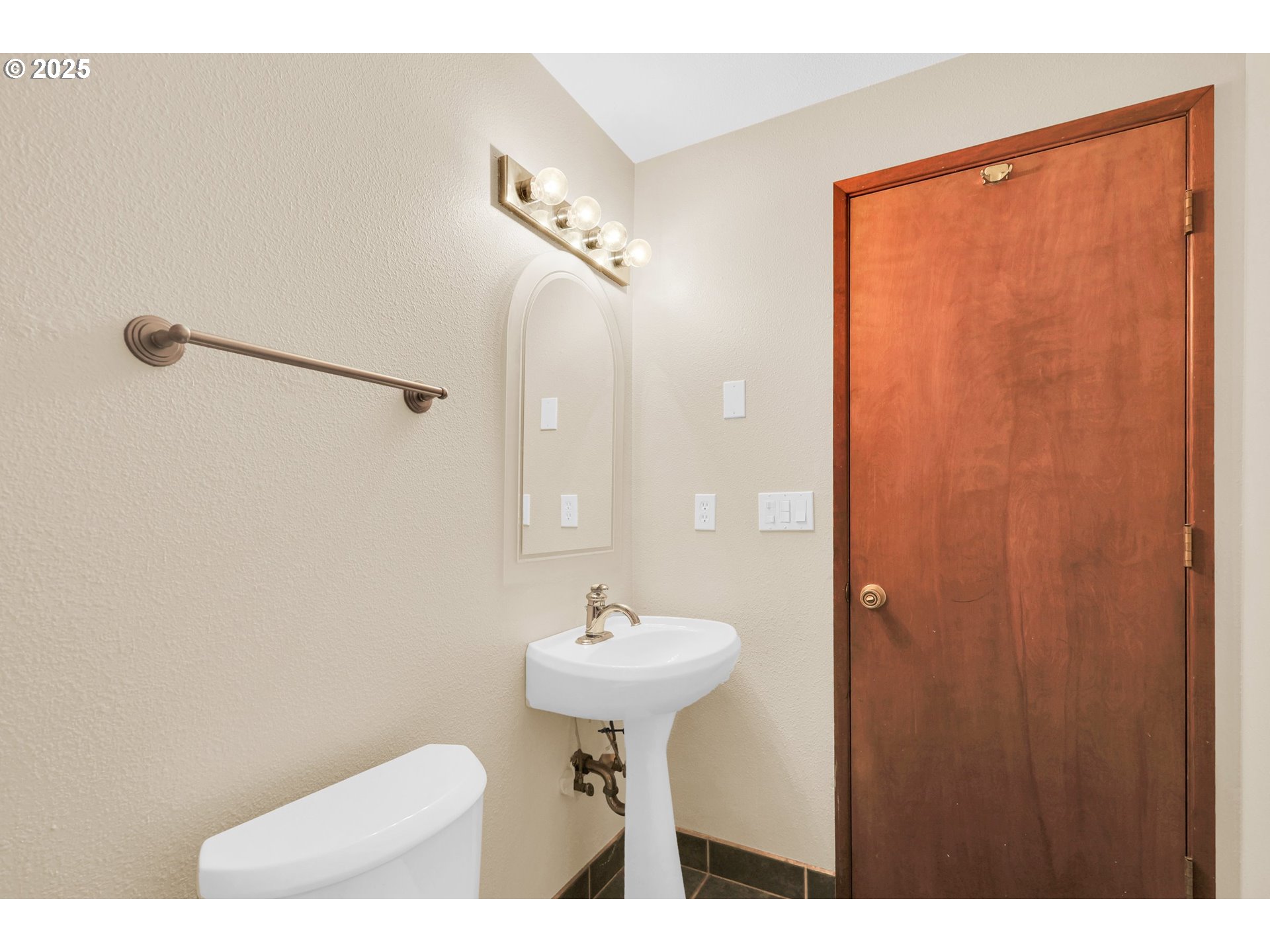 1003 Northwest 132nd Street Vancouver, WA 98685 - Photo 22 of 26 a bathroom with a sink a toilet and a mirror