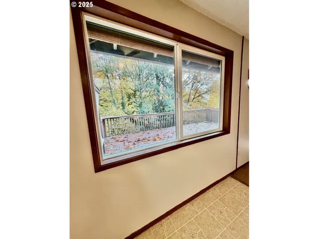 a view of a room with a large window