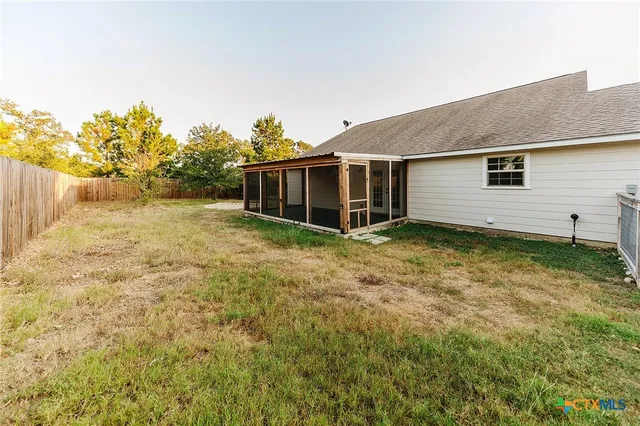 a backyard of a house with lots of green space