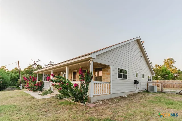 a view of a porch with a potted plant