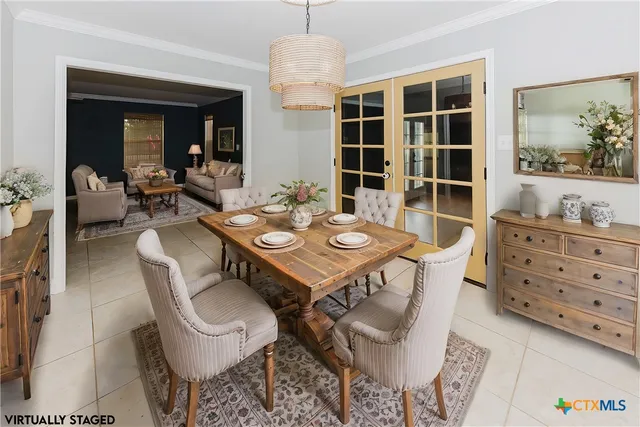 a kitchen with stainless steel appliances granite countertop a stove top oven a sink dishwasher and a refrigerator with wooden cabinets