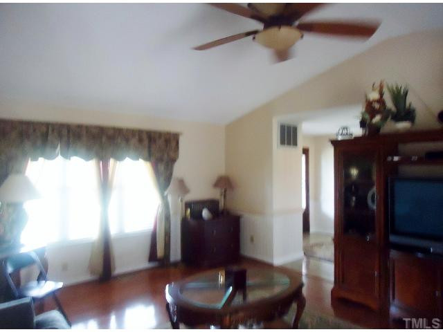 100 Harris Road Smithfield, NC 27577 - Photo 5 of 22 Living Room with ceiling fan and hardwood floors Living Room