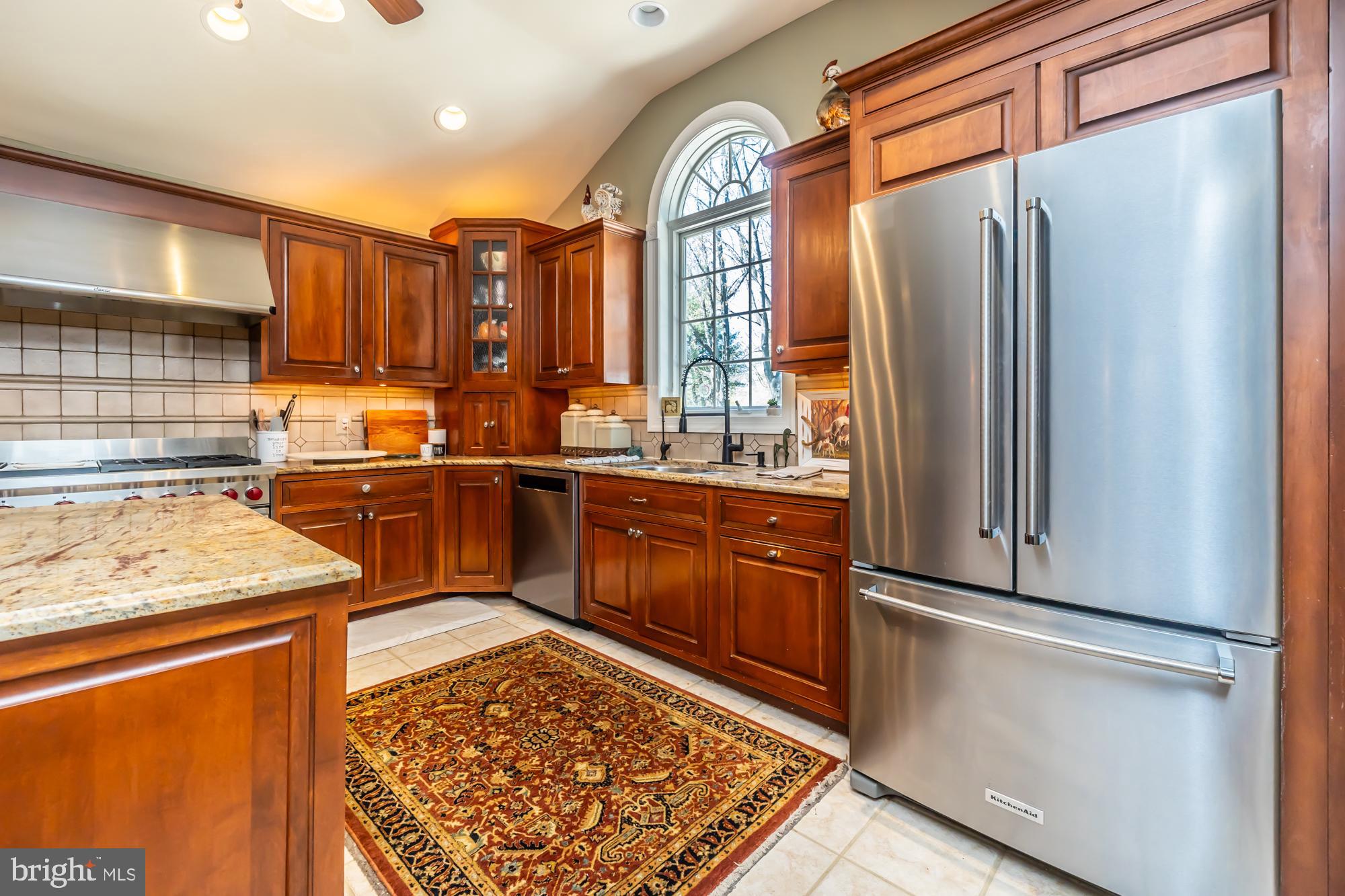 414 Manor Drive Kennett Square, PA 19348 - Photo 16 of 35 a kitchen with stainless steel appliances granite countertop a refrigerator and a sink