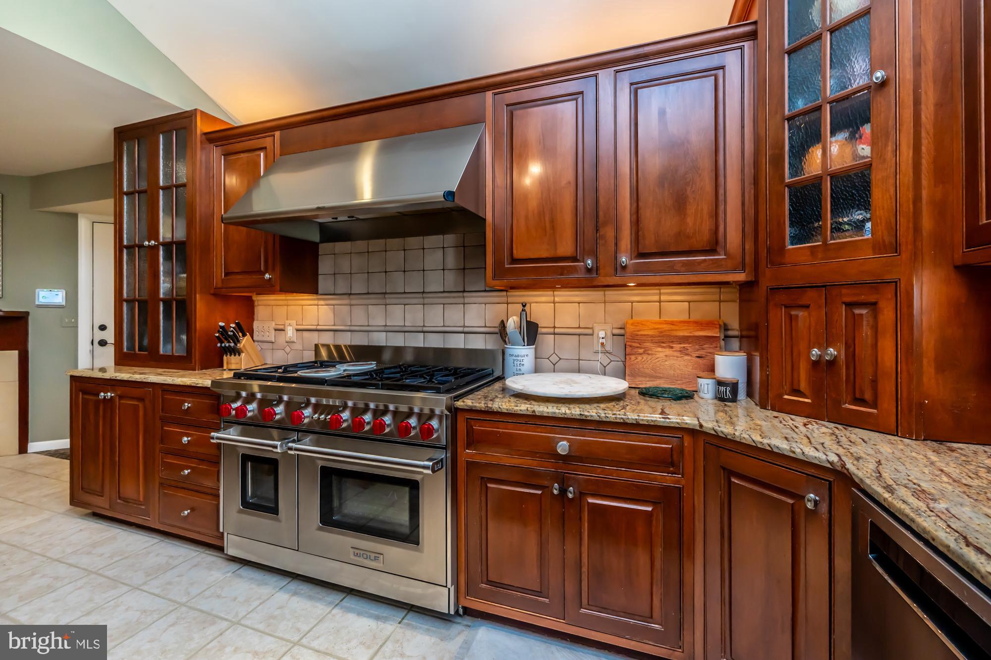 414 Manor Drive Kennett Square, PA 19348 - Photo 17 of 35 a kitchen with stainless steel appliances granite countertop a stove and a cabinets