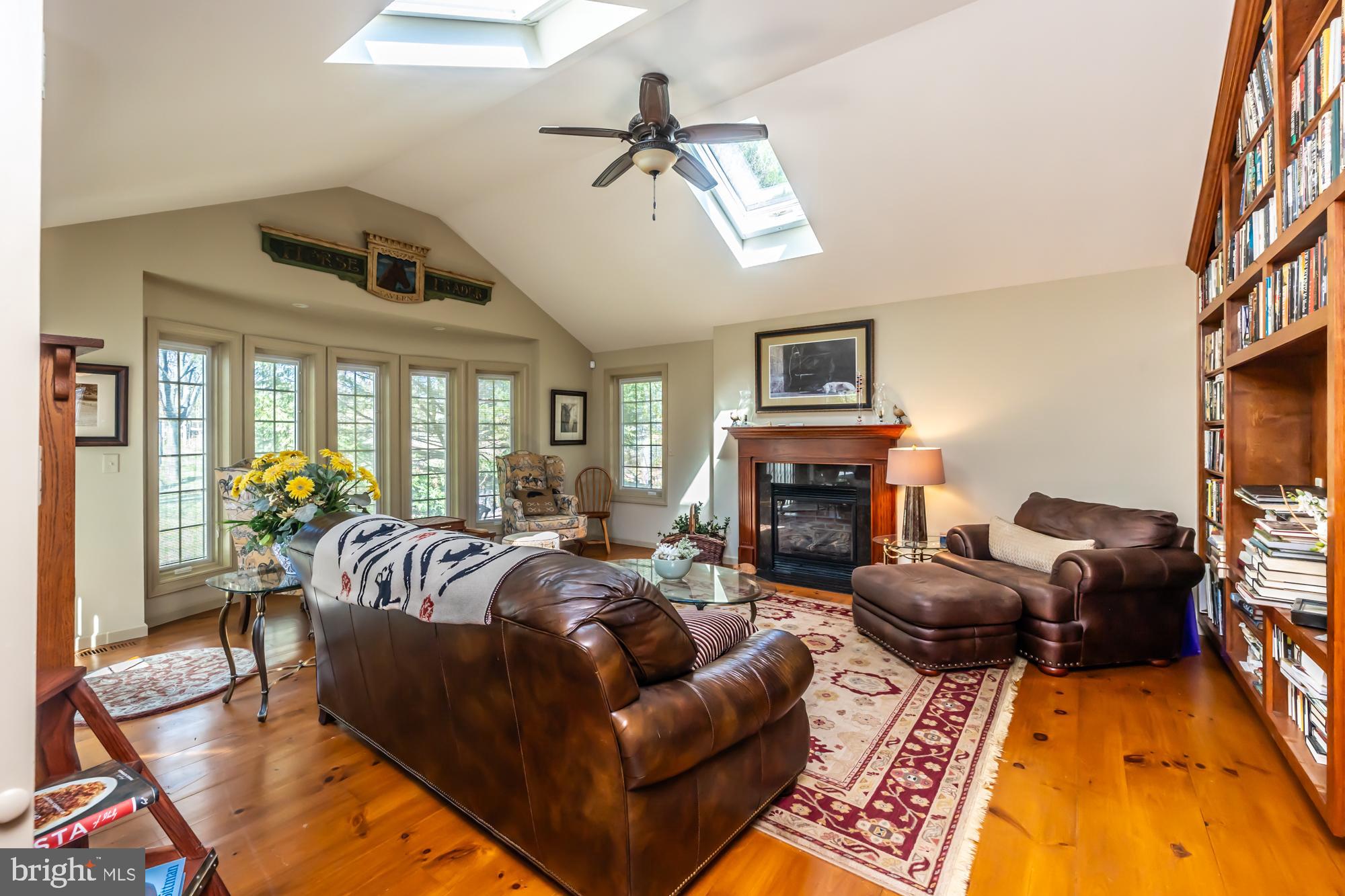 414 Manor Drive Kennett Square, PA 19348 - Photo 20 of 35 a living room with furniture fireplace and a flat screen tv