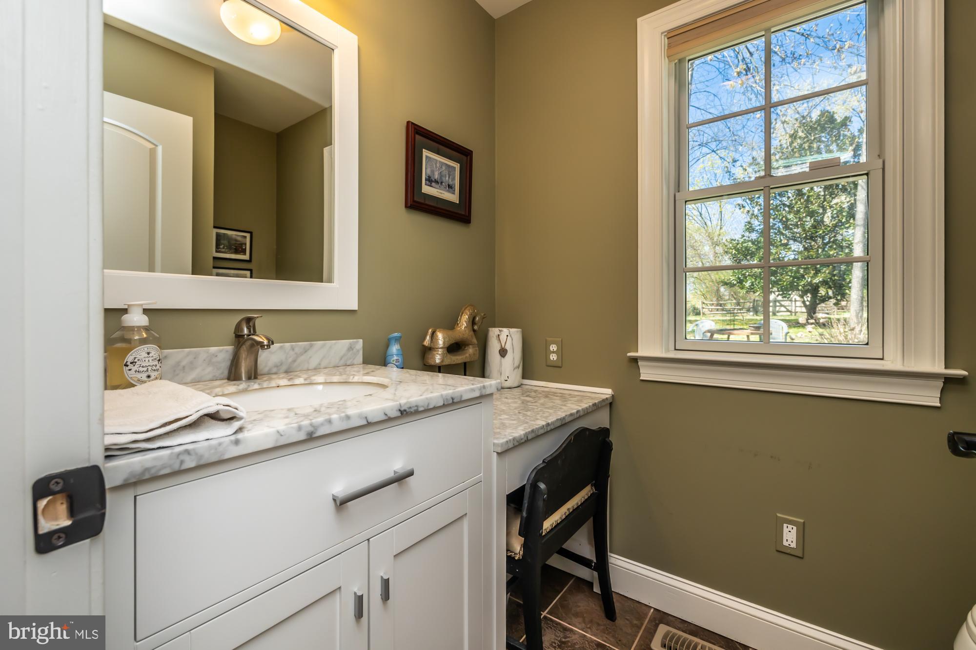 414 Manor Drive Kennett Square, PA 19348 - Photo 26 of 35 a bathroom with a granite countertop sink and a window