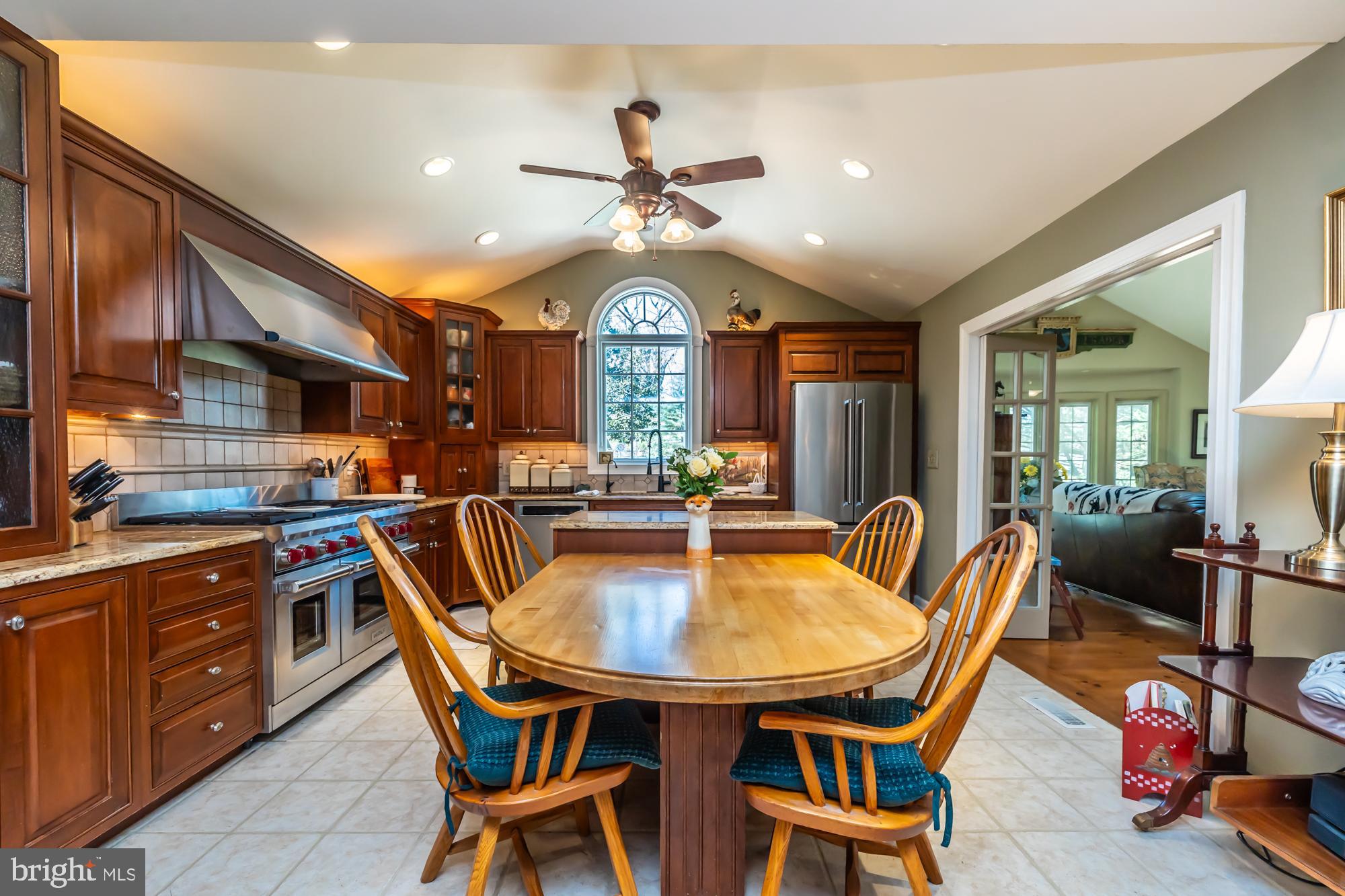 414 Manor Drive Kennett Square, PA 19348 - Photo 7 of 35 a dining room with furniture and a chandelier