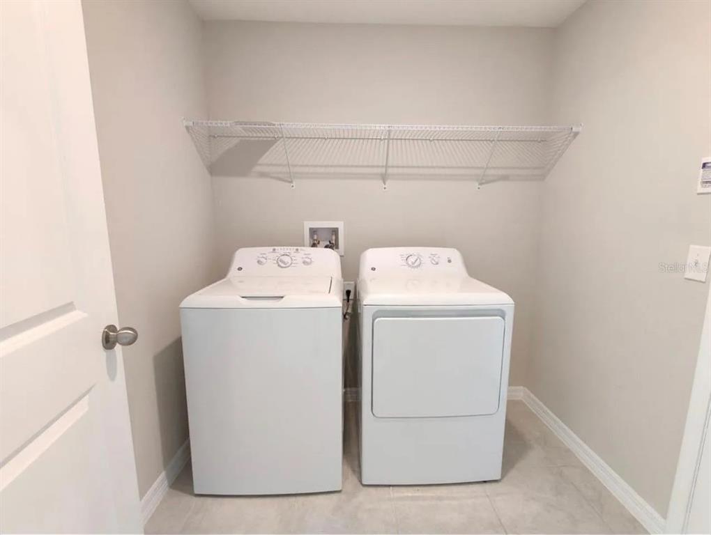 31699 Sun Kettle Loop Wesley Chapel, FL 33545 - Photo 11 of 18 a utility room with dryer and washer