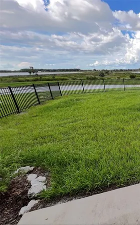 a view of a golf course with a lake