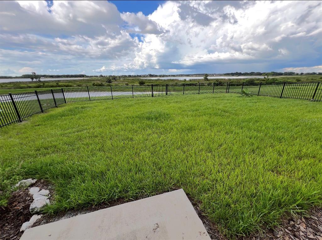 31699 Sun Kettle Loop Wesley Chapel, FL 33545 - Photo 18 of 18 a view of a golf course with a lake