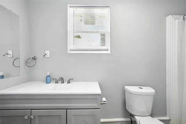 a bathroom with a toilet and a sink