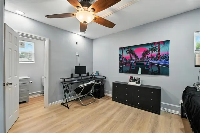 a livingroom with workspace and a window