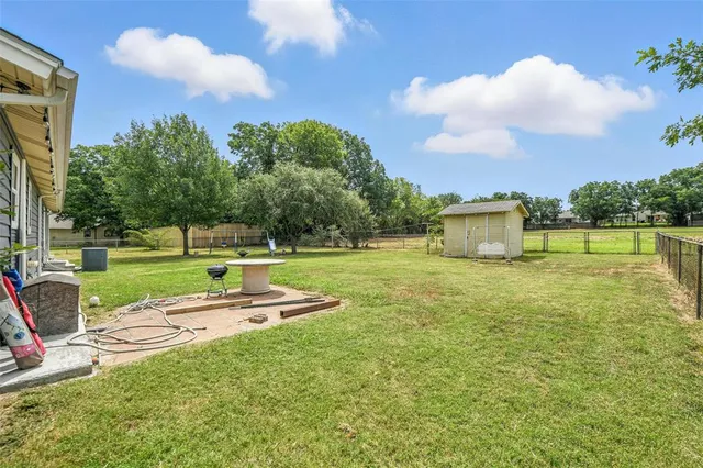 a view of a park with large trees