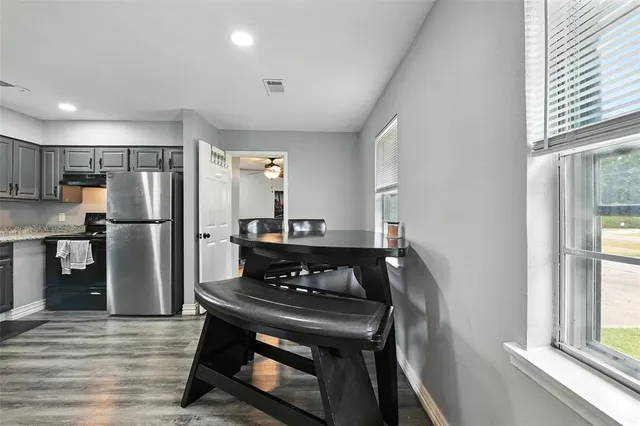 a kitchen with a stove and a refrigerator